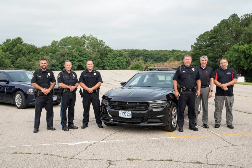 Participants in the Sedalia Police Department&rsquo;s formal presentation of a 2017 Dodge Charger with emergency lights to the Missouri Safety Center at the University of Central Missouri included, from left, SPD officers Josh Howell, Adam Hendricks, David Woolery, Police Chief Matt Wirt, UCM President Roger Best, and Missouri Safety Center Senior Program Manager Mike Perkins.   Photo courtesy of the University of Central Missouri