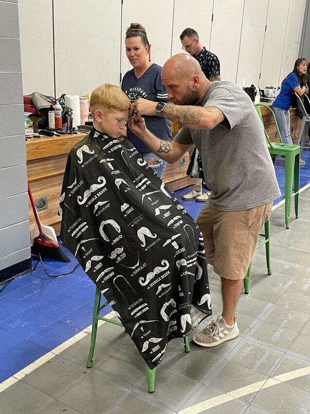 Stylists from Missouri Barber Company and Great Clips give free back-to-school haircuts at Boys &amp;amp; Girls Club&rsquo;s National Night Out.   Photo courtesy of Boys &amp;amp; Girls Clubs of West Central Missouri