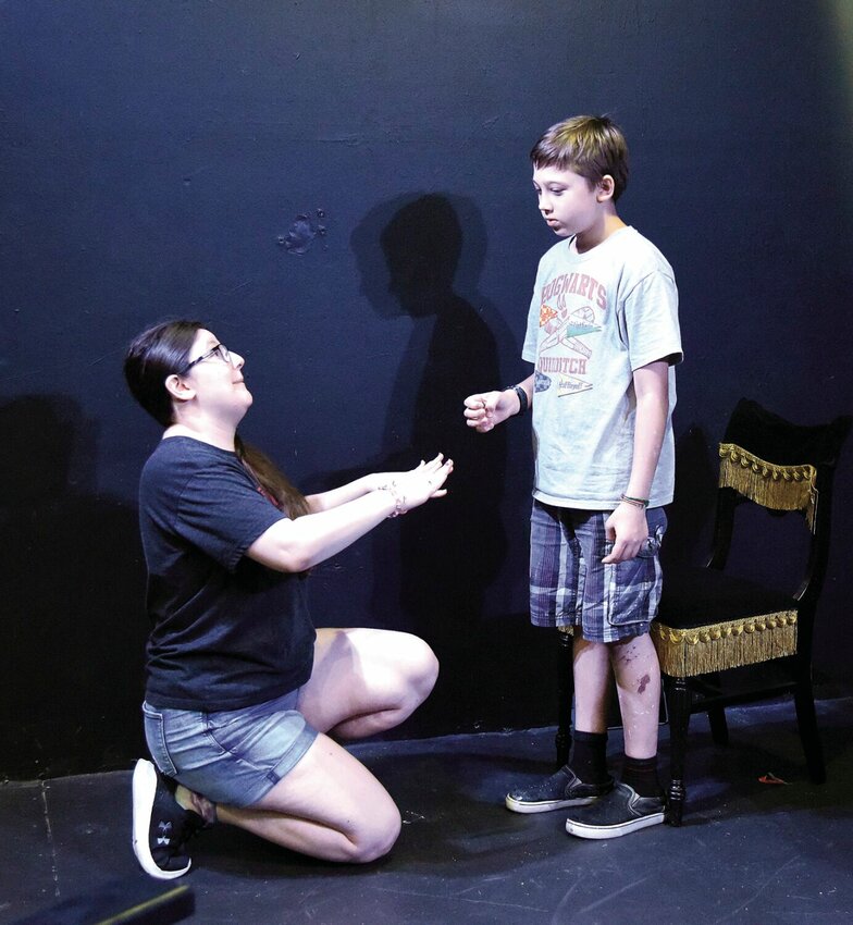 During rehearsal Thursday, Aug. 3, Lillibeth Sokolowski, who plays MC, pleads for her job with her boss, played by Gabriel Peterson, in the Liberty Center Jr. Theatre play, &ldquo;The Five Shards of Alessandro.&rdquo; The production, which was produced by students in one week, will be presented at 7:30 p.m. Saturday, Aug. 5.&emsp;Photos by Faith Bemiss | Democrat