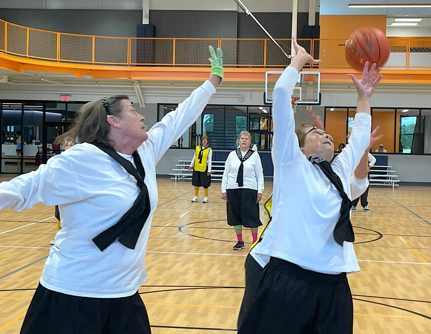 Grace Toebben and Patsy Brandt of Missouri's Show Me Shooters played an exhibition game of Granny Basketball on Sunday, Aug. 6 against the Kansas Meadowlarks. The games helped Care Connection for Aging raise money for senior programs.   Photo by Chris Howell | Democrat