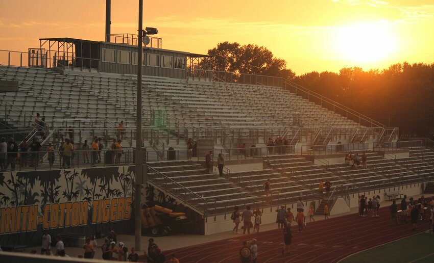 The sun goes down on S-C Stadium near the conclusion of the football program's Tiger Night event held on July 27. S-C is among area schools who have postponed start times or games altogether on Friday, the first day of fall sports contests.   PhotoCredit: Photo by Bryan Everson | Democrat
