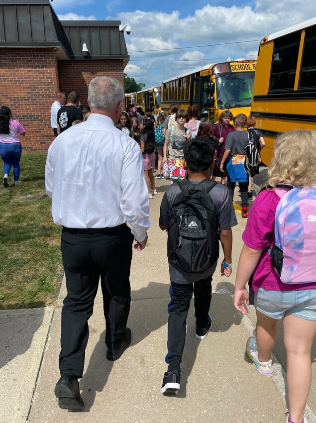 Sedalia School District 200 Assistant Superintendent Chris Pyle helps Sedalia Middle School students find their bus home after the first day of school in the 2023-24 year on Monday, Aug. 28.   Photo by Chris Howell | Democrat