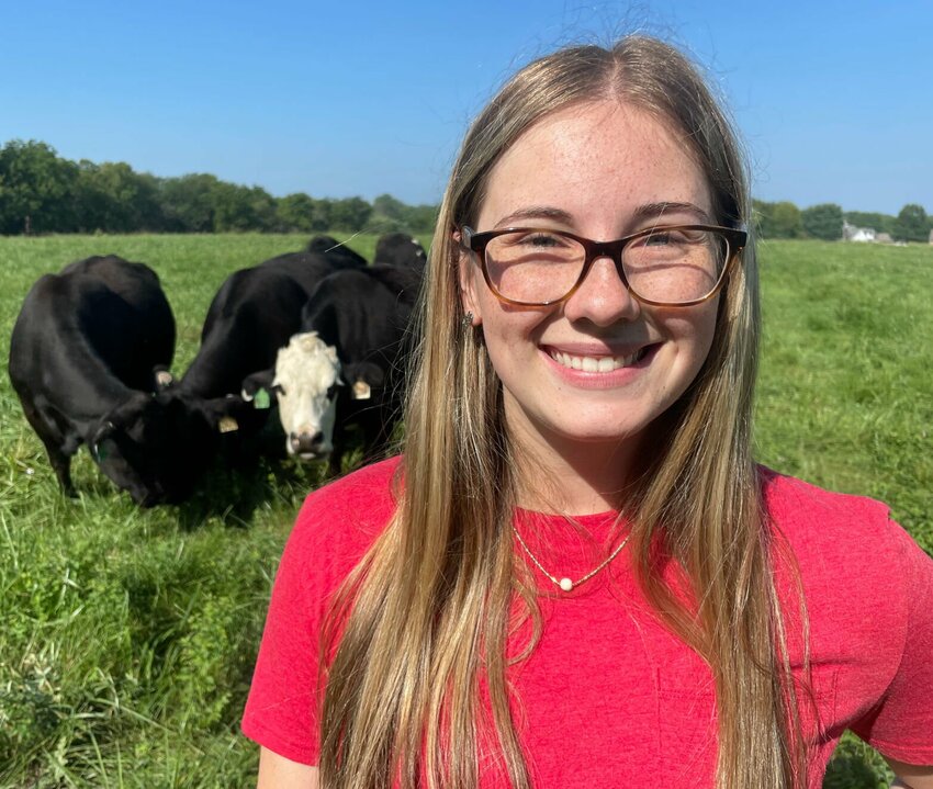 State Fair Community College freshman Macy Reed, of Green Ridge, helps work on the college's new 200-acre farm Wednesday, Aug. 30. The agri-business student helps manage the herd of 23 cows and one new calf.   Photo by Chris Howell | Democrat