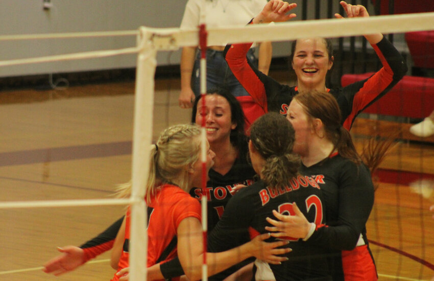 Stover volleyball celebrates a point against Warrensburg on Tuesday at Warrensburg High School.   PhotoCredit: Photo by Joe Andrews | Warrensburg Star-Journal