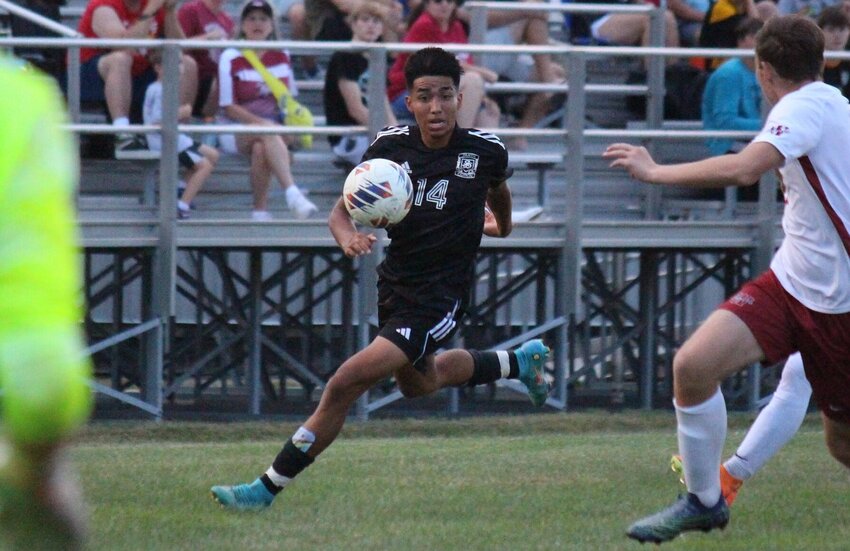 The team's eventual talisman later in the half, Smith-Cotton sophomore Jeydan Salazar runs onto a ball in Tuesday's home match against Warrensburg that ended in a 1-1 draw.   PhotoCredit: Photo by Bryan Everson | Democrat