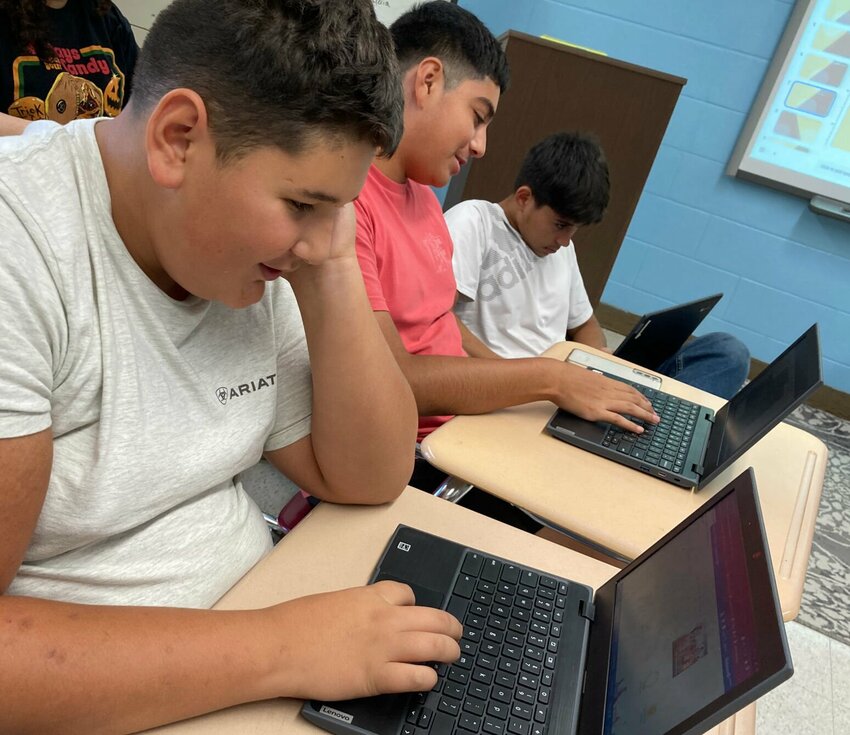 Eighth grade La Monte student Ricardo Garcia, freshman Jonzel Rios, and freshman Gabe Knight-Lintz work to put out the new student publication, The La Monte Gjallarhorn, Tuesday, Sept. 12 in Taylor Mankin's yearbook class.   Photo courtesy of Taylor Mankin