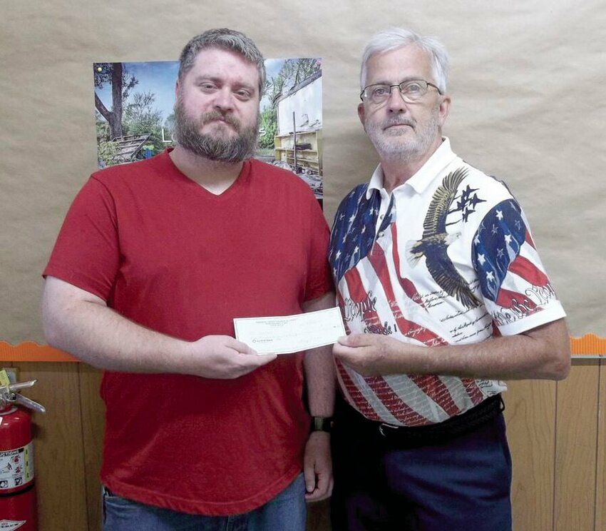 Immanuel United Church of Christ recently donated $1220 to the C.A.C.T.U.S. School Kits Program. Pictured are William Gerlt of Immanuel, left, and Warren Semler of C.A.C.T.U.S.   Photo courtesy of Phillip Gerlt&nbsp;