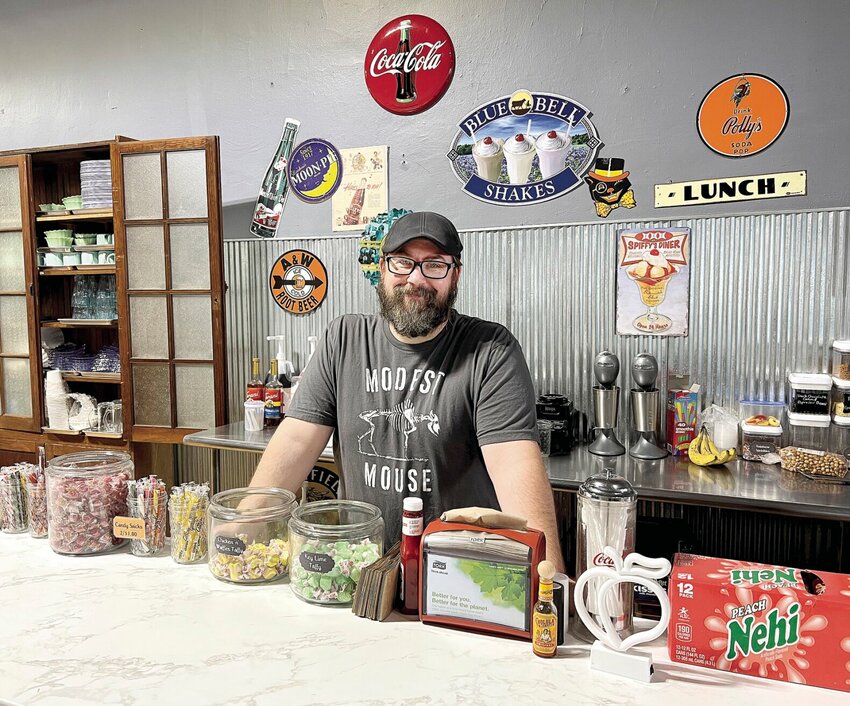 Owner and Chef Chris Paszkiewicz stands at the Cow Bird Creamery and Sweets counter on Tuesday, Sept. 19 in downtown Sedalia. Paszkiewicz and his wife, Lynn, own the eatery and plan to offer a full Southern dinner menu beginning next week.   Photo by Faith Bemiss-McKinney | Democrat