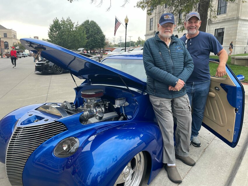 Owner Robert Hayden, of Sedalia, and his son-in-law Jim Van der Linden pose next to the 1939 Chevy they spent three years having customized from the ground up by Mike Zenevich, of Smithton. The pair brought the car to the West Central Missouri Vintage Auto Club car show on Saturday, Sept. 23 in downtown Sedalia.   Photo by Chris Howell | Democrat