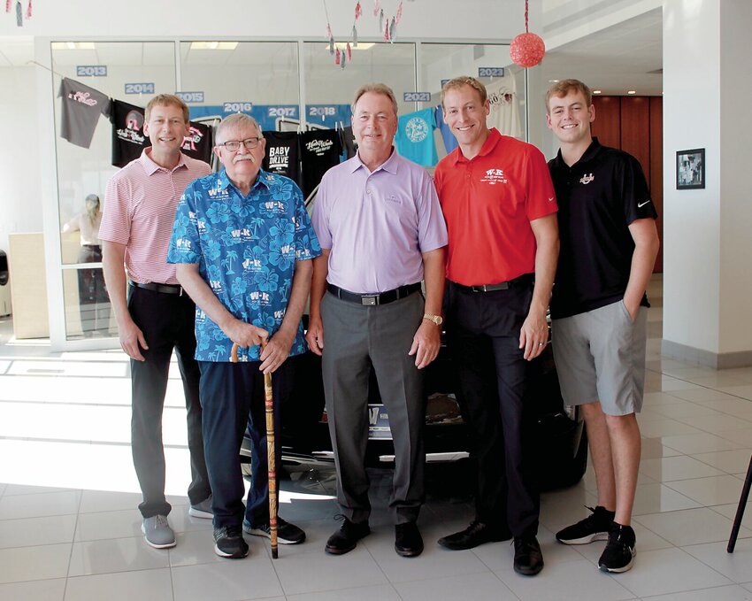 During his anniversary celebration Friday, Sept. 29 at W-K Chevrolet, Bob Bond stands with members of the Weymuth family who own the dealership. From left are Kyle Weymuth, Bond, Ken Weymuth, Kelsey Weymuth, and Karson Weymuth. Not pictured was younger brother Kendall, who was working. The well-known salesman, Bond, retired after 50 years.   Photo courtesy of W-K Chevrolet&nbsp;