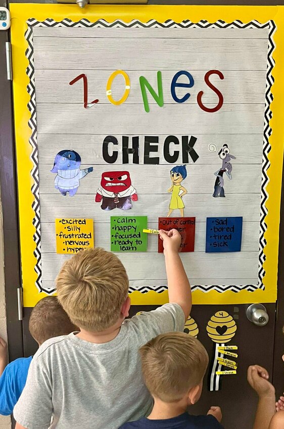 Students in Skyline Elementary teacher Zara Hoover's social skills class check in on the feelings chart at the start of the class. The chart helps students recognize and deal with their emotions.   Photo courtesy of Sedalia School District 200