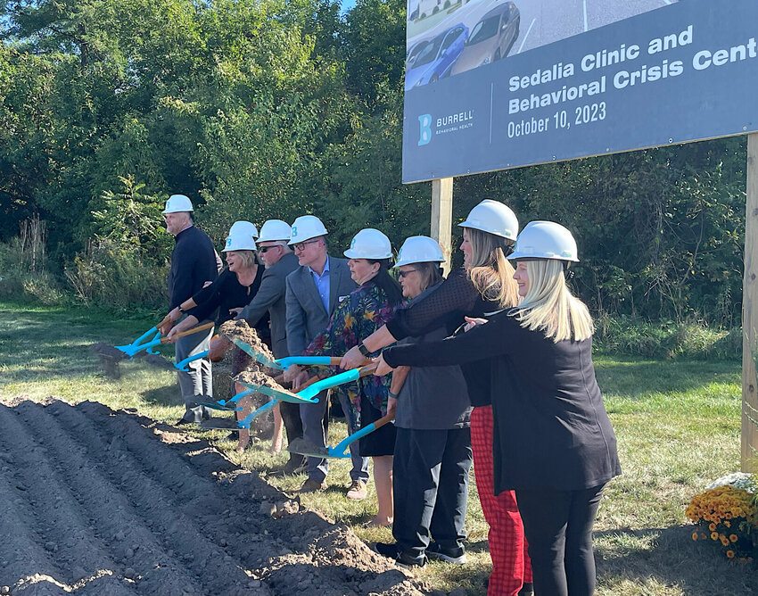 Executives with Brightli, the parent company of Burrell Behavioral Health, and employees turn dirt for the groundbreaking of the new Burrell Behavioral Health Clinic, 1801 W. Main St., on Tuesday, Oct. 10. The facility is due to open in late 2024.   Photo by Chris Howell | Democrat