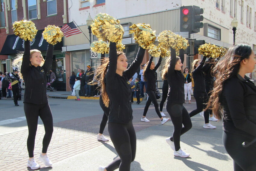 Members of the Smith-Cotton High Voltage Dance and Cheer Squad raise their pom-poms high during the 2022 Homecoming parade in downtown Sedalia. The 2023 parade is scheduled for 3 p.m. Friday, Oct. 13.   File photo by Skye Melcher | Democrat