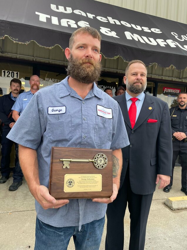 George McKernon was given a Key to the City on Friday, Oct. 13 by Mayor Andrew Dawson for his actions saving a City worker involved in an traffic accident in front of the business two weeks ago.   Photo by Chris Howell | Democrat