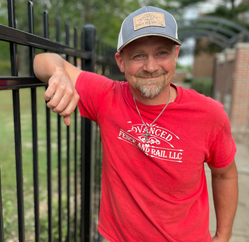 Brent Guier, owner of Advanced Fence and Rail, is supported by his three kids, his wife and business partner Valerie, and his faith in God.   Photo by Chris Howell | Democrat