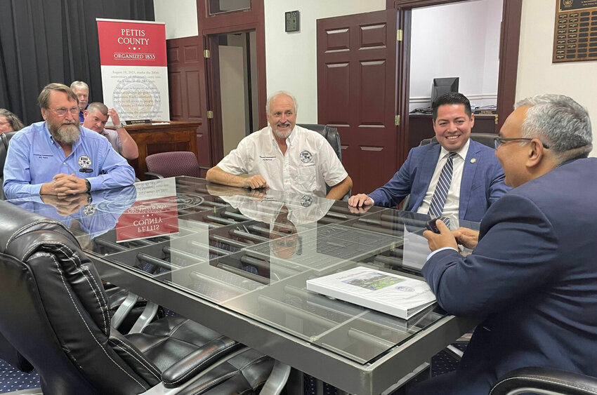 From left, Pettis County Commissioners Bill Taylor, Jim Marcum and Israel Baeza meet with Missouri State Treasurer Vivek Malek on Monday, Oct. 30 in their chambers to discuss the MOBUCK$ program.   Photo by Chris Howell | Democrat