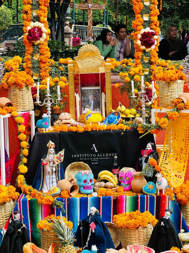 On Thursday, Nov. 2 for Dia de Los Muertos (Day of the Dead) in San Miguel de Allende, Mexico, residents decorate the square with ofrendas (altars) in memory of deceased loved ones. Altars can be elaborate or simple. This altar is from the Instituto Allende, a visual art school.   Photo by Faith Bemiss-McKinney |Democrat