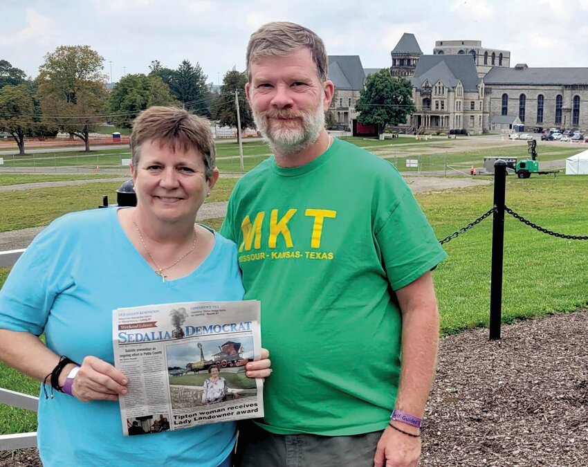 John and Linda Hoffmann, of Sedalia, took a copy of the Democrat with them while visiting their son in Ohio. They're holding the Democrat prior to a four-mile walk to raise money for the Pontifical College Josephinum Seminary in Worthington, Ohio.   Photo courtesy of John and Linda Hoffmann