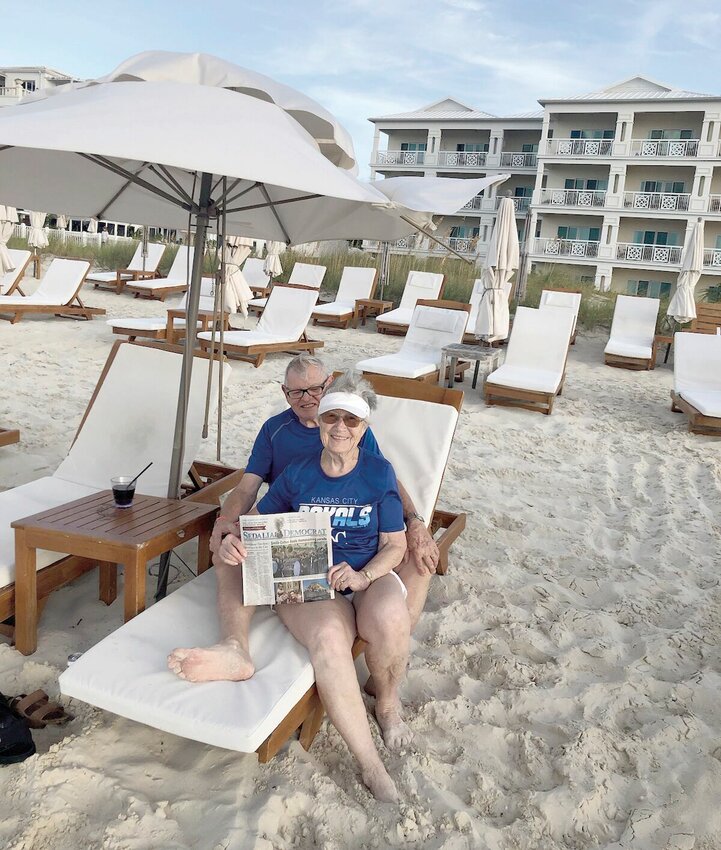 Jerry and Kay Greer took a copy of the Democrat with them to the Alexandra Resort at the Turks and Caicos Islands to while celebrating their birthday.   Photo courtesy of Jerry Greer