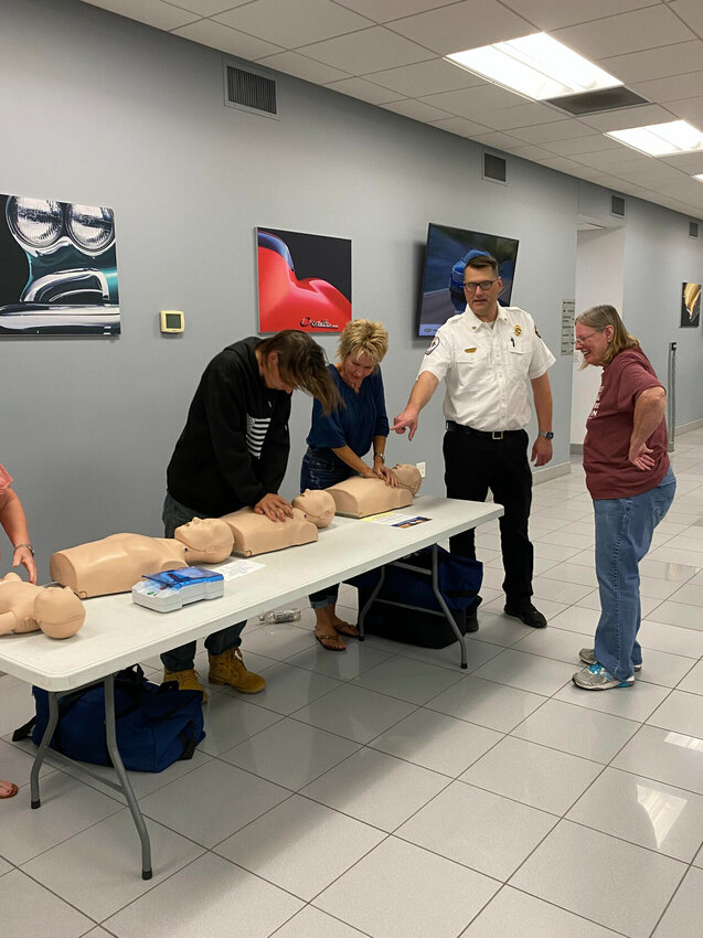 The Sedalia Optimist Club, along with W-K Chevrolet, recently hosted a CPR training course. Pettis County Ambulance District Division Chief of Training Justin Cross gave the group basics on CPR.   Photo courtesy of Sedalia Optimist Club