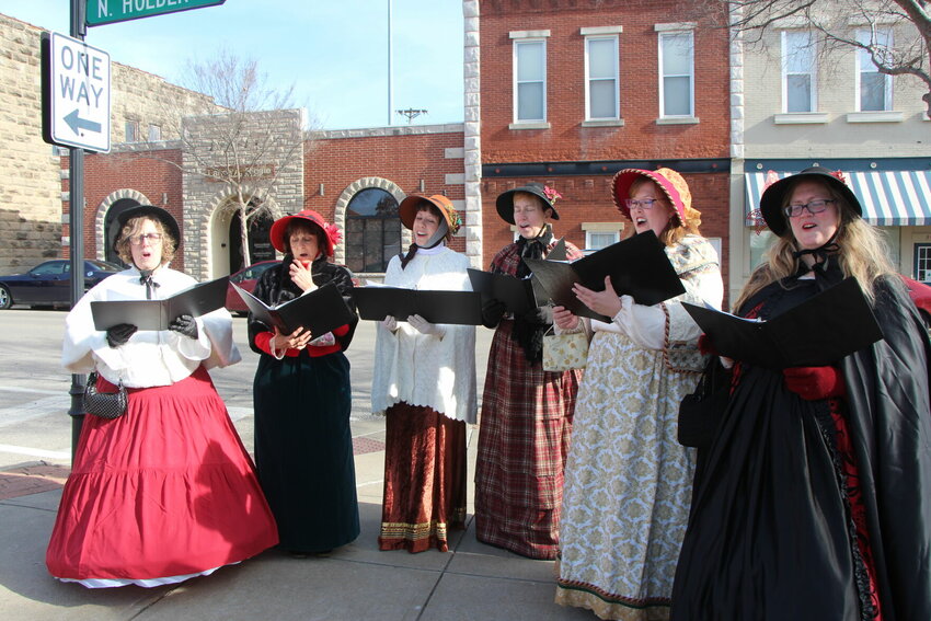 Merry Maidens carol along the streets of downtown Warrensburg during Dickens' Christmas in 2022. This year's event will be hosted Saturday, Dec. 2.   Photo courtesy of Warrensburg Main Street