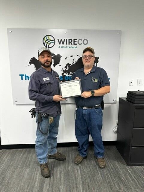 Michael Hawkins is presented the Journeyman Certificate in Industrial Electrical Maintenance.   Photo courtesy of State Fair Community College