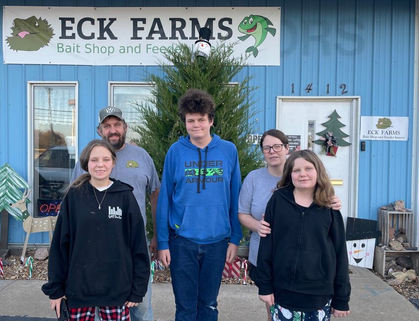 From left, Eddie Hart, along with son Clyde, wife Christina, and daughters Emma and Katy, stand in front of Eck Farms, 1412 S. Maguire St. in Warrensburg. The local business opened its storefront in April.   Photo by Zach Bott | Warrensburg Star-Journal