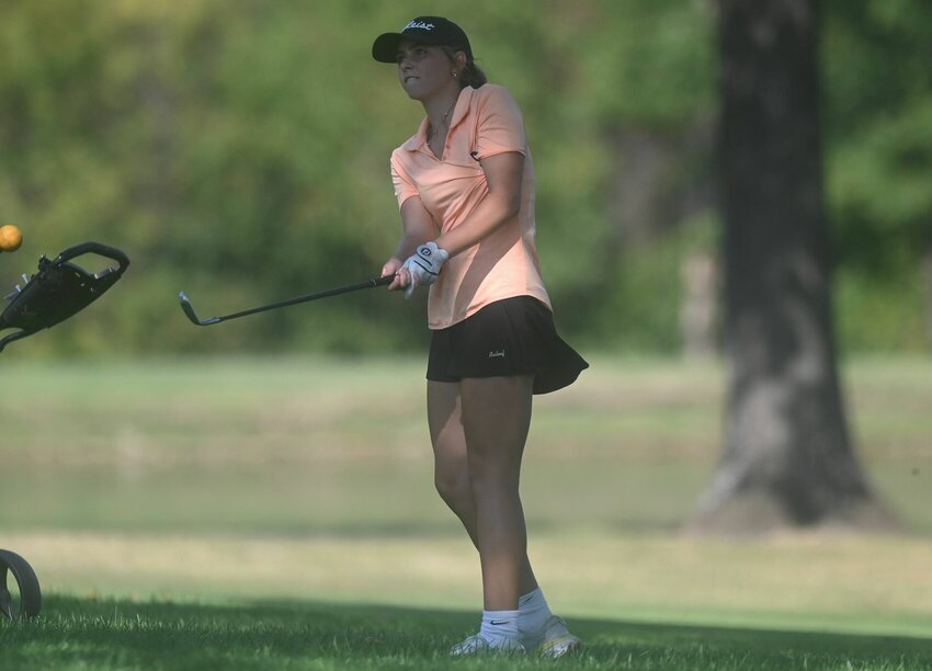 Stover's Mia Rowland watches a shot at Sedalia Country Club on Oct. 2 as part of the Kaysinger Conference Tournament. The Lady Bulldogs won their district tournament to qualify for the Class 1 State Tournament.&nbsp;   PhotoCredit: File photo by Bryan Everson | Democrat