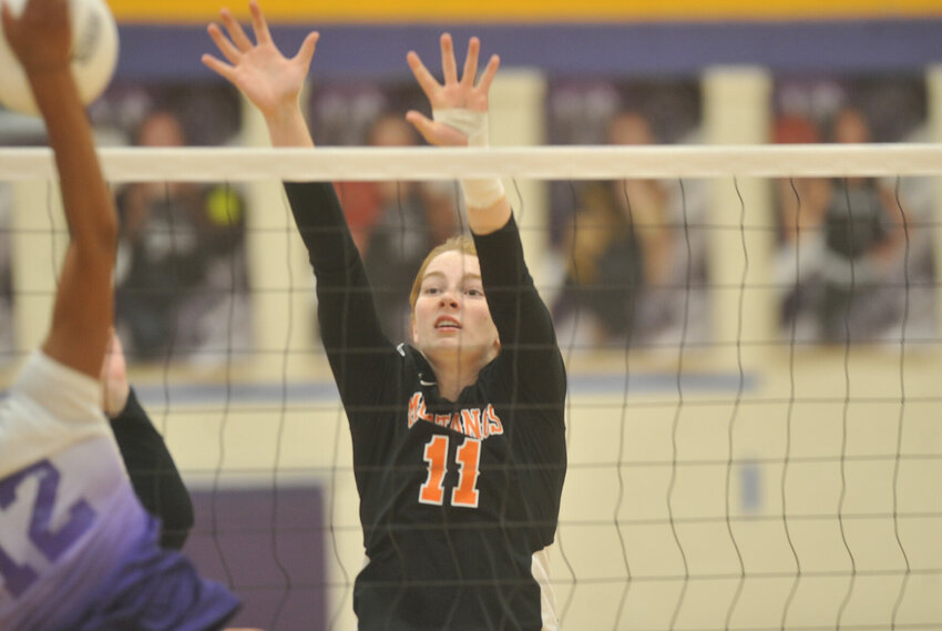 Pictured here in a Nov. 29, 2022 match, Northwest senior Karli Smith finished with a team-high nine blocks, as well as 18 kills and 17 digs in Saturday's Class 1 quarterfinal victory in Hughesville that sends the Lady Mustangs to the Final Four for the first time.   PhotoCredit: File photo by Bryan Everson | Democrat
