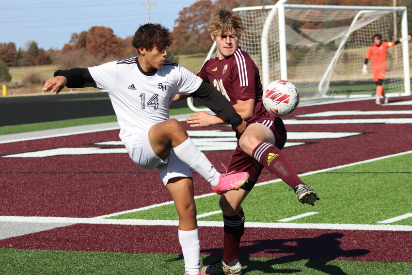 Sacred Heart junior Ramses Rivera-Montoya battles for the ball in Saturday afternoon's Class 2 state quarterfinal in Rogersville against the Wildcats.   PhotoCredit: Photo courtesy of Sacred Heart Athletics
