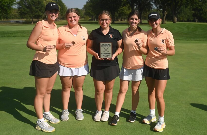 Stover's quintet of Brooklyn Black, Mia Rowland, Maddy Finkenbine, and Ava and Ella Hodges hold up individual medals, as well as the first-place Kaysinger Conference Girls Tournament trophy. Tipton won the inaugural tourney at Sedalia Country Club last fall.&nbsp;   PhotoCredit: Photo by Bryan Everson | Democrat