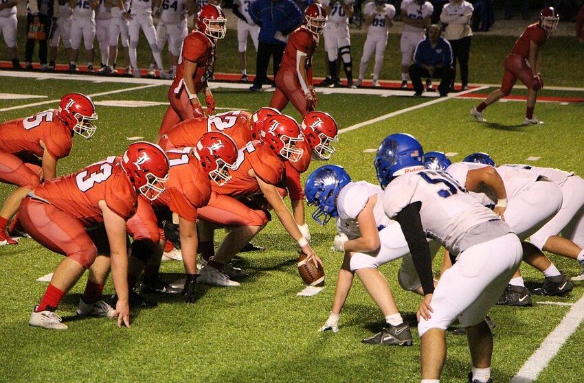 Lincoln prepares to snap the ball at the line-of-scrimmage in Friday night's rivalry tilt at home against Cole Camp.   PhotoCredit: Photo courtesy of Susyn Mitchell Sanders