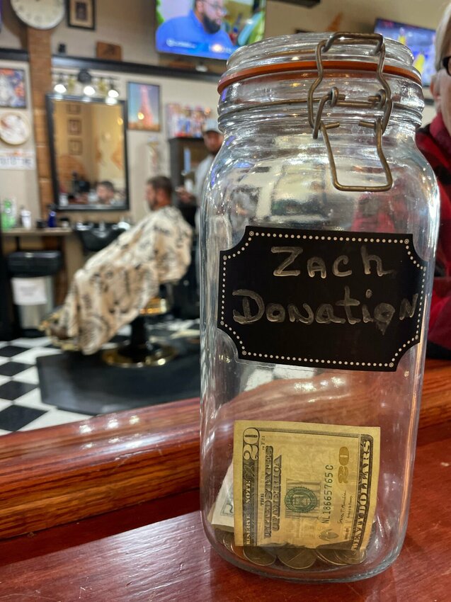 The Two-Bit Barber Company is raising money to help in the rehabilitation of one of their barbers, Zachary Monath, who was injured in a Nov. 4 motorcycle wreck.   Photo by Chris Howell | Democrat