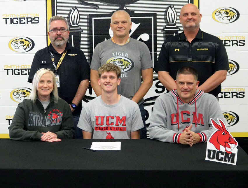 Smith-Cotton High School senior Clay Pilliard has been invited to participate in track and field as a preferred walk-on at the University of Central Missouri in Warrensburg. Seated with him are his parents, Kara and Sean Pilliard; back, from left: S-C Principal Wade Norton, S-C Track and Field Head Coach Charlie McFail, and S-C Athletic Director Rob Davis.   PhotoCredit: Photo courtesy of Sedalia School District 200&nbsp;
