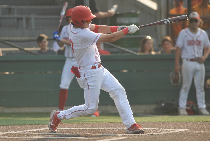 Sacred Heart junior Carter Rice, one of four first-team All-Kaysinger selections from the Gremlins takes a swing at a pitch while playing a game at Liberty Park Stadium.   PhotoCredit: File photo by Bryan Everson | Democrat