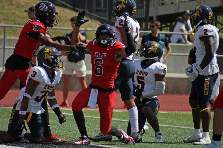 Central Missouri redshirt senior wide receiver Arkell Smith signals a touchdown against Central Oklahoma on Saturday, Sept. 9, at Walton Stadium.   PhotoCredit: Photo by Joe Andrews | Star-Journal