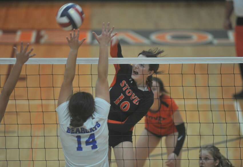 Stover junior Ashlyn Pinzke attacks a ball in a postseason match against Hermann at the Stover Dome on Oct. 29, 2022.   PhotoCredit: File photo by Bryan Everson | Democrat