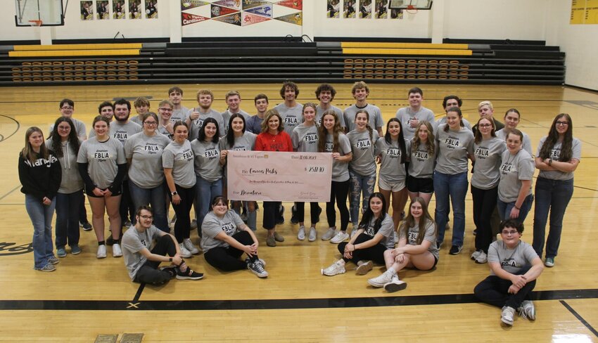 Smithton FBLA and the junior high and high school volleyball teams sponsored Pink Week at Smithton School to raise funds for Cancer Perks of Sedalia. A donation of $2517.40 was made to Cancer Perks of Sedalia on behalf of Smithton School.   Photo courtesy of Smithton R-VI School District