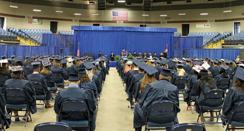Hundreds of SFCC graduates listen to Dean of Health Services Dr. Rhonda Hutton Gann, the 2022 Distinguished Alumni recipient, give the commencement address Friday, May 13, 2022.   File photo by Nicole Cooke | Democrat
