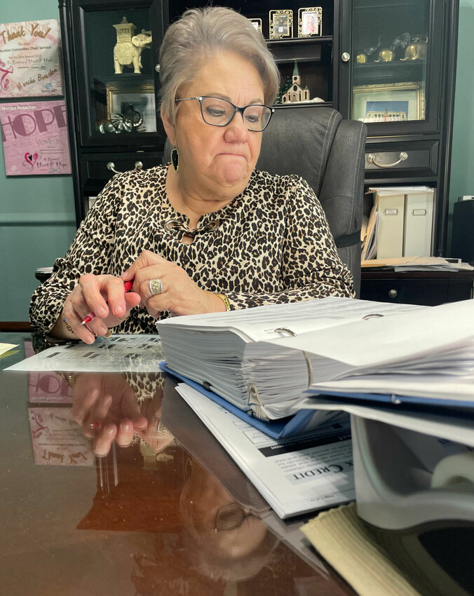Pettis County Collector Marsha Boeschen has made a list and is checking it twice hoping taxpayers will update their information and be sure to pay taxes by Dec. 31 to avoid penalties.   Photo by Chris Howell | Democrat