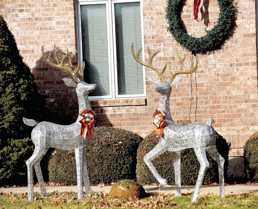 On Tuesday, Dec. 19, two deer sparkle in the afternoon sun in a yard in the 5000 block of Locust Lane in Sedalia. As Christmas nears, Sedalians are going all out with holiday yard decorations.   Photo by Faith Bemiss-McKinney | Democrat