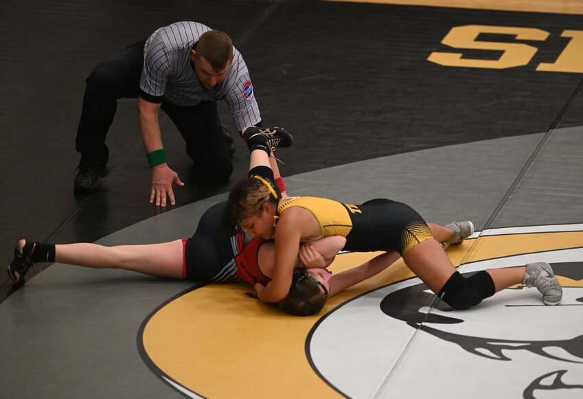 Smith-Cotton junior Jazlyn Smith-Freeman (120 pounds) works on Marshall's Emmi Boling before an eventual pin in Tuesday night's home triangular.   PhotoCredit: Photo by Bryan Everson | Democrat