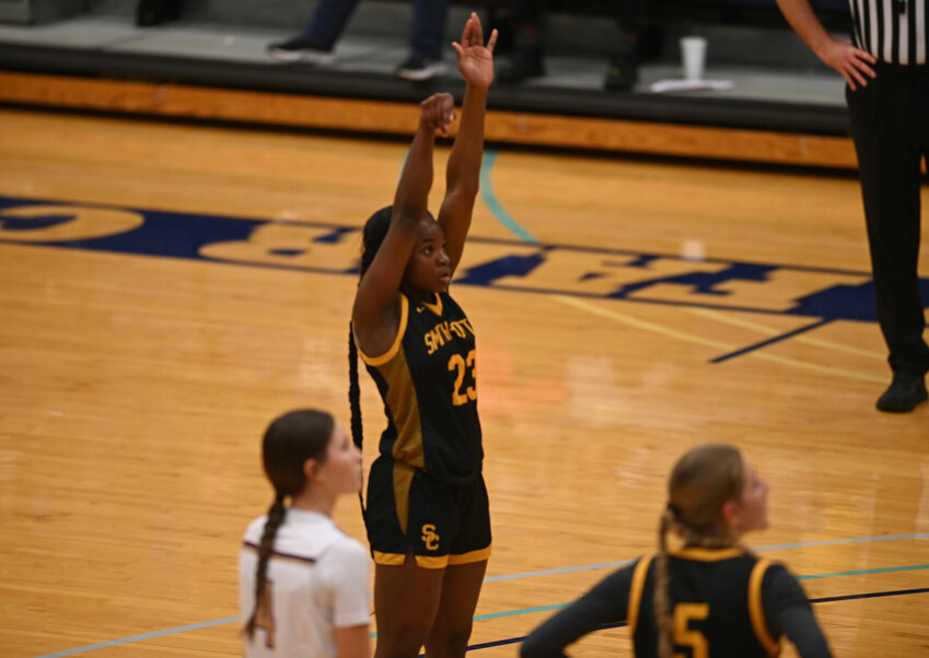 Pictured here knocking down a free throw in the win over Eldon on Dec. 16, Smith-Cotton sophomore Dominique Bell has seen her scoring rise to help propel the Lady Tigers on their recent winning streak.   PhotoCredit: Photo by Bryan Everson | Democrat