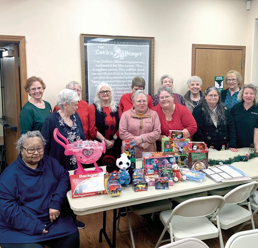 Church Women United pose for a photo with toys and money they donated to Pettis County Community Santa.   Photo courtesy of Church Women United&nbsp;