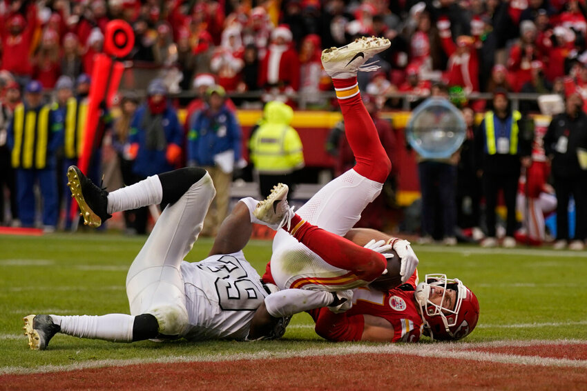 Kansas City Chiefs wide receiver Justin Watson, right, catches a touchdown pass as Las Vegas Raiders cornerback Nate Hobbs defends during the second half of an NFL football game Monday, Dec. 25, 2023, in Kansas City, Mo.   PhotoCredit: Photo by Charlie Riedel | AP Photo