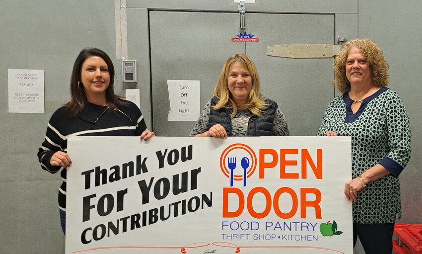 Tyson Foods, which primarily gives back by supporting hunger relief, recently awarded the Open Door Service Center a grant for $20,000. The funds were used to replace the service center&rsquo;s cooler internal components. From left, Open Door Executive Director Amanda Davis, Warehouse Supervisor Victoria Powell and Director of Development Michelle O&rsquo;Donnell.   Photo courtesy of Open Door Service Center