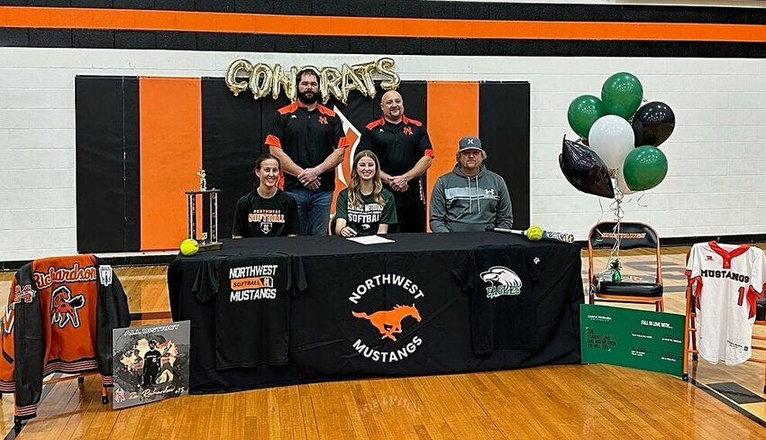 Northwest senior Zoe Richardson (front, center), seen here at last month's signing ceremony in Hughesville, becomes the lastest student-athlete from Hughesville to go on to play college athletics. She'll likely be utilized in the outfield at Central Methodist University despite being a versatile player at Northwest.&nbsp;   PhotoCredit: Photo courtesy of Northwest Mustangs