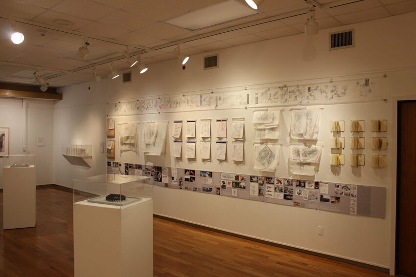 Design sketches and workbooks line the gallery walls at the &quot;Empowered by Design&quot; exhibition on Wednesday, Jan. 17, in at the University of Central Missouri Art Center Gallery.&nbsp;   Photo by Zach Bott | Warrensburg Star-Journal
