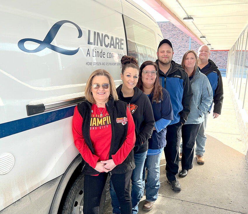 Friday morning, Jan. 19, Sedalia LINCARE Inc. staff members stand beside a LINCARE van. From left, Sherry Hodges, center manager; Leanna Dedman, customer service representative; Deanna Keller, respiratory specialist; Trevor Simmons, service representative; Brenda Coleman, LPN, health care specialist, and Robert Largent, Sr. service representative. The business will move Friday, Jan. 26, to a larger location on West 32nd Street.   Photo by Faith Bemiss-McKinney | Democrat