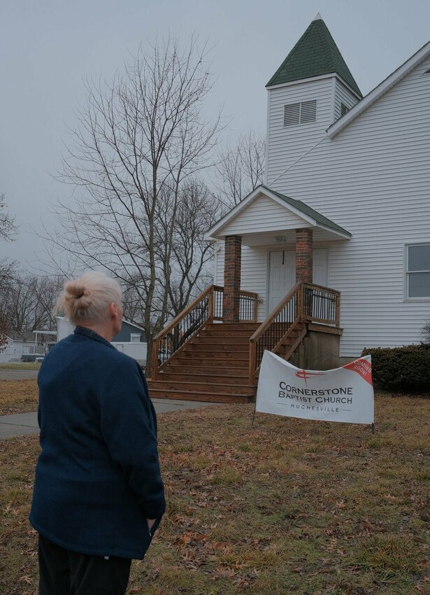 Hughesville City Clerk Catherine Sanchez lives across from the Cornerstone Baptist church, 206 Moore St. in Hughesville, and appreciates them renovating the 1887 church for the small community.   Photo by Chris Howell | Democrat